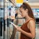 woman reading food label